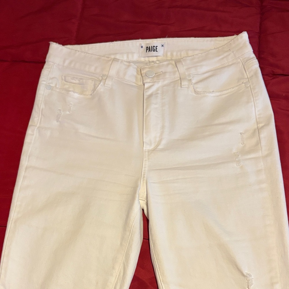 PAIGE Women's White Skinny Jeans highly distressed.